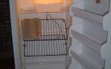 freezer interior with egg racks tipped forward