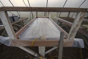 A 3" "bathtub" is constructed from 3/8" plywood and poly.
