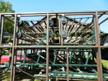 Side view showing a bine being stripped (harvested).